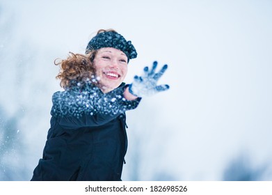 Girl Throwing Snow Ball