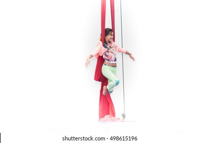 Girl Tilts On Red Silk During Circus Class