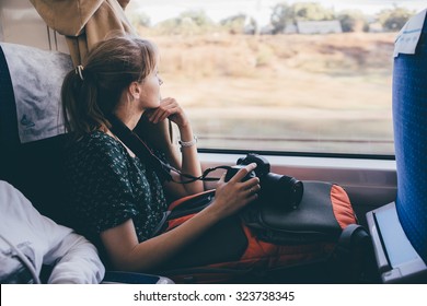 Girl Tourist Is Looking Out The Window. Fast Train