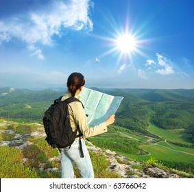 Girl Tourist In Mountain Read The Map