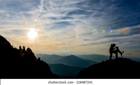 Girl Training Her Dog On Top Of The Mountain