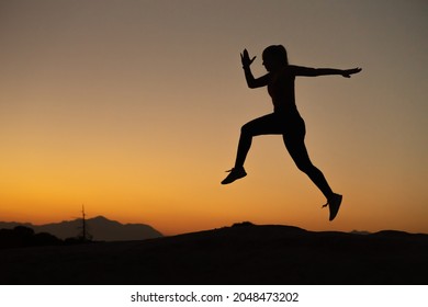 Girl Training Running Technique In The Mountains At Sunset Time, With Copy Space.