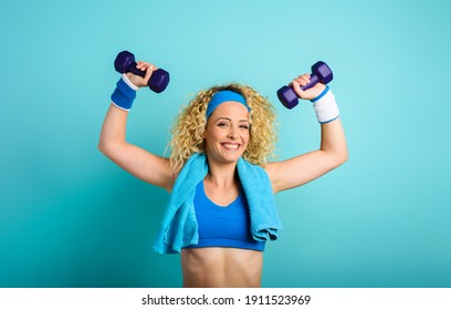 Girl trains with handlebars. cyan color background