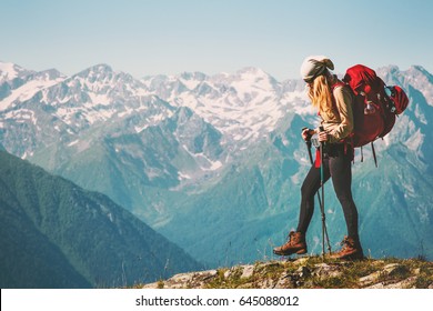 Girl Traveler hiking with backpack at rocky mountains landscape Travel Lifestyle concept adventure summer vacations outdoor 