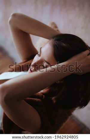 Similar – a girl with her hair by her face lying on the bed