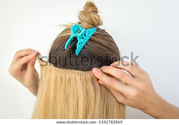 Girl Tries On Blonde Remy Clip Stock Photo Edit Now 1342782869