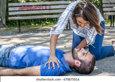 Girl Trying To Find Help For An Unconscious Guy