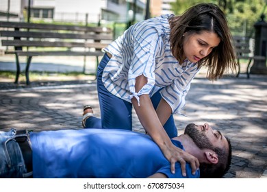 Girl Trying To Find Help For An Unconscious Guy