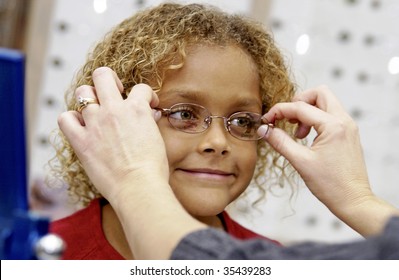 Girl Trying On Eye Glasses