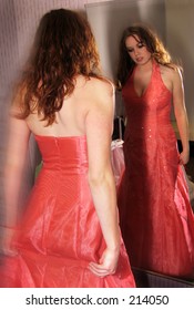 Girl Trying On Prom Dress And Looking In Mirror