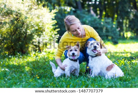 Similar – Image, Stock Photo Blond woman with her two dogs in the countryside