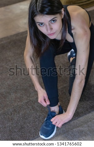 Similar – Image, Stock Photo Woman stretching on yoga mat in a yoga studio