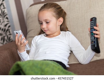 A Girl Undecided Who Can Not Choose Between TV Or Phone