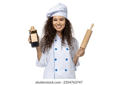 A girl in the uniform of a chef, isolated on white background