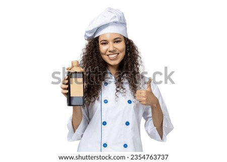 A girl in the uniform of a chef, isolated on white background