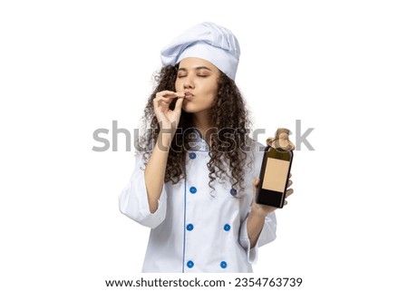 A girl in the uniform of a chef, isolated on white background