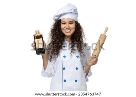 A girl in the uniform of a chef, isolated on white background