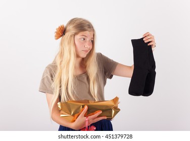 Girl Unpacked Her Present And A Bit Upset Because It Was A Pair Of Black Socks Only.