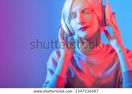 Young DJ woman in a night party