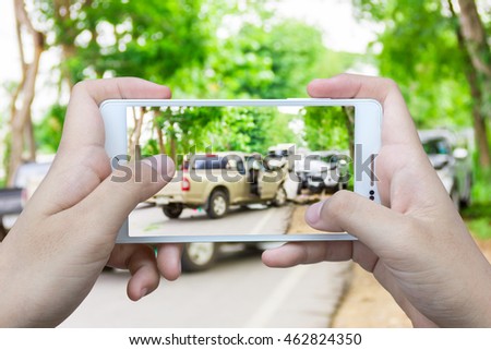 Girl use mobile phone , blur image of accident on the road as background.