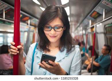 Girl Use Smartphone Inside The Train In Hong Kong