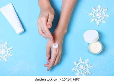 The Girl Uses Cream. Winter Hand Skin Care.