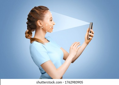 The girl uses face recognition in her smartphone. 