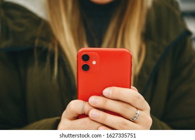 The Girl Uses A New Cell Phone With A Dual Camera.