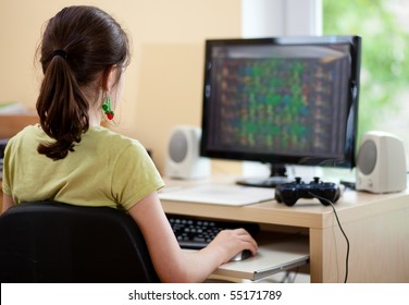 Girl Using Computer At Home