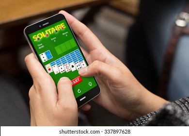 girl using a digital generated phone with cards app. All screen graphics are made up. - Shutterstock ID 337897628
