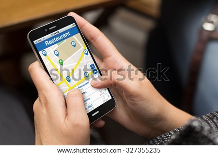 girl using a digital generated phone with restaurant search website on the screen. All screen graphics are made up.