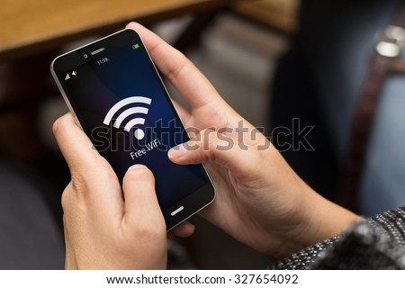 girl using a digital generated phone with free wifi on the screen. All screen graphics are made up.