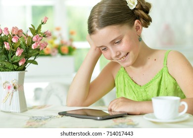 girl using digital tablet