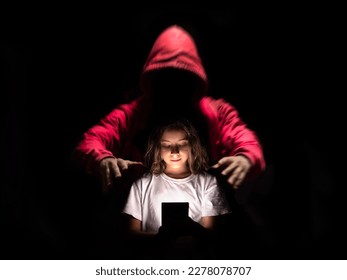A girl using her cell phone on social networks without being aware of the dangers they can have. - Shutterstock ID 2278078707