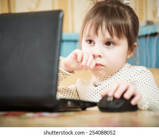 Girl Using Laptop in the room.