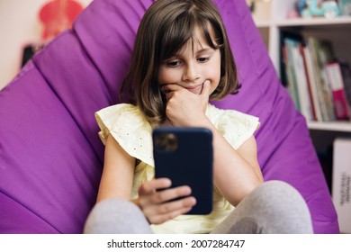 Girl Using Mobile Phone Or Chat. Kid Using Smartphone, Child Browsing Internet On Smart Phone, Teenager Girl Communicating With Parents, Technology On Device