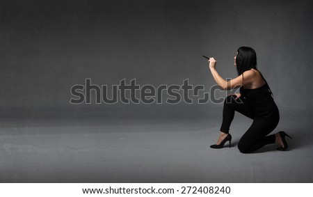 girl using pen on an empty wall