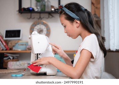 Girl using a sewing machine