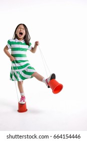 A Girl Using Stilts