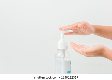 A girl using washing hand with Alcohol Sanitizer isolate on a white background. Promoting people use  to protect themselves from virus infection in Corona virus crisis 2020 - Shutterstock ID 1659122359