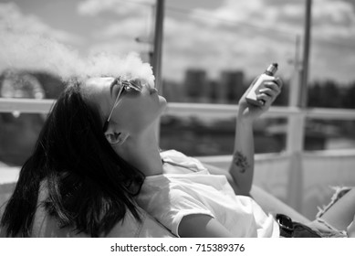 Girl Vaping In