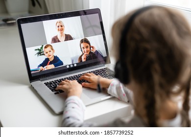 A Girl Video Conferencing With Happy Female Teacher On Laptop - Shutterstock ID 1857739252