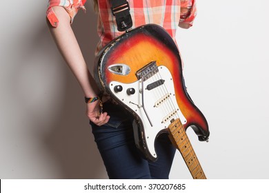 girl with a vintage electric guitar is back