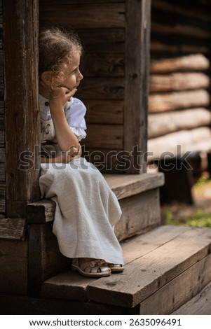 Girl in vintage Russian-style dress, traditional attire