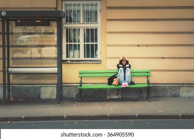 Girl Waiting For A Bus.