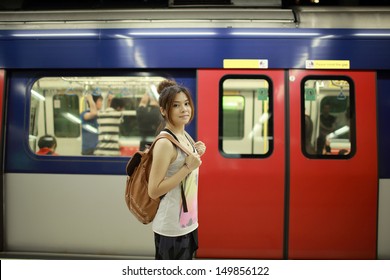 Girl Waiting The Train MTR Platform Ready To Go, Start Her Journey In Hong Kong