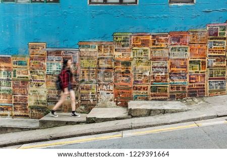 Girl walking in the colorful street in Hong Kong city