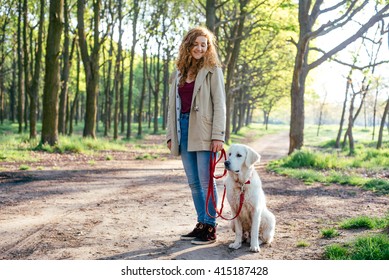 Girl Walking Dog In Park