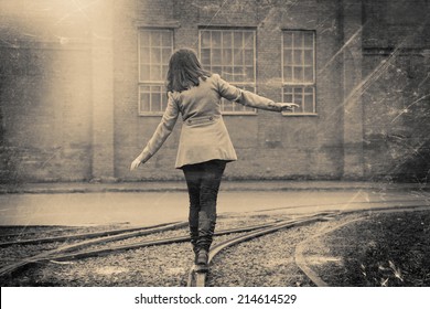 girl walking on the railway, retro stylized in black and white colors photo