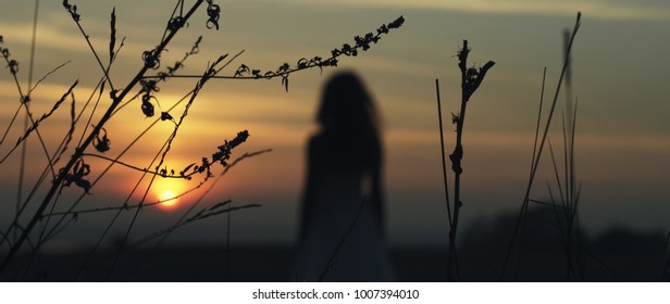 girl walking on the sunset